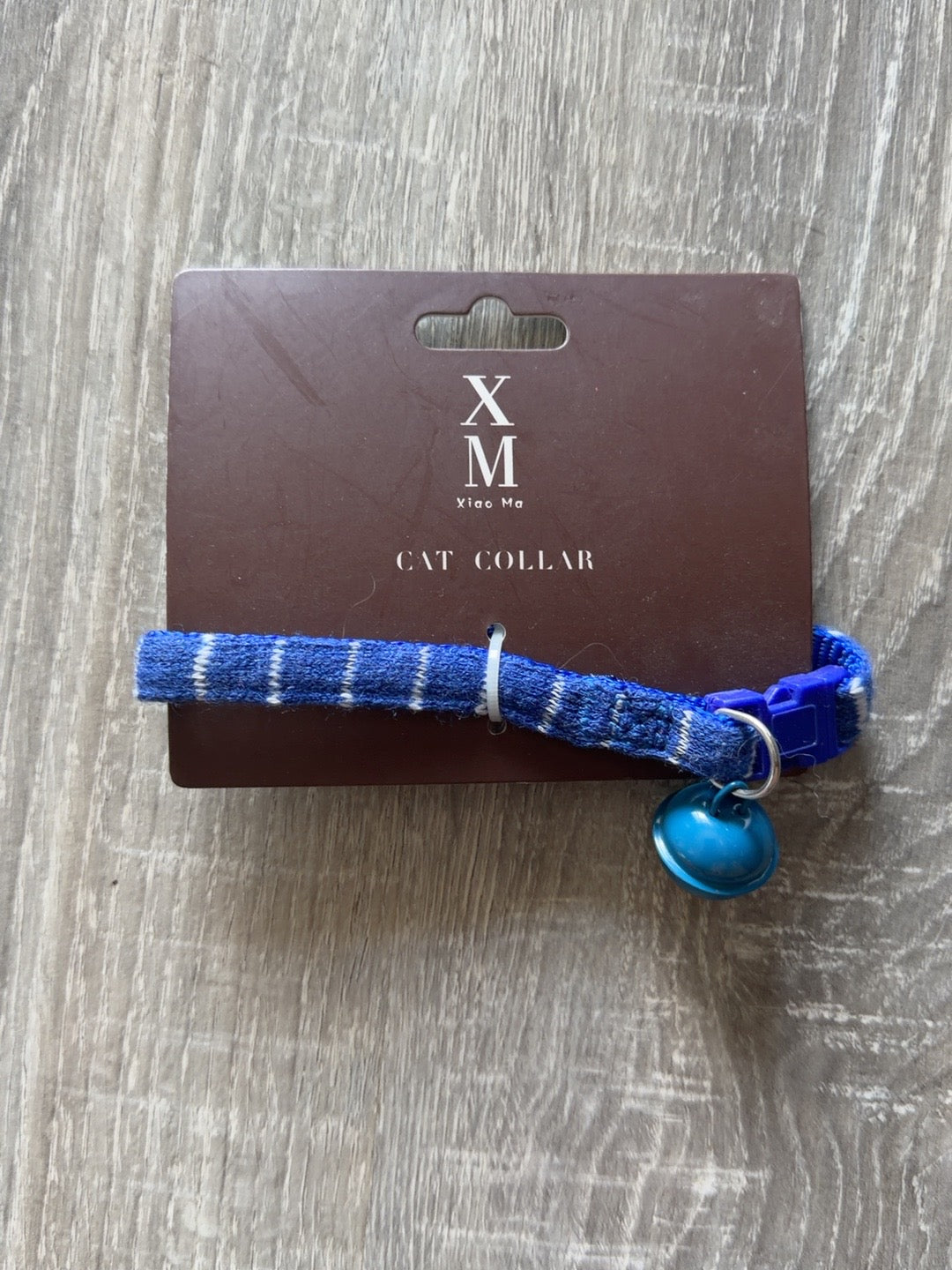 Blu a righe con campanellino blu